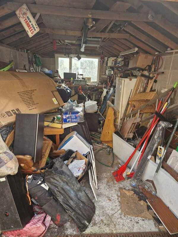 Before photo of a cluttered house or room needing professional clearance in Devon